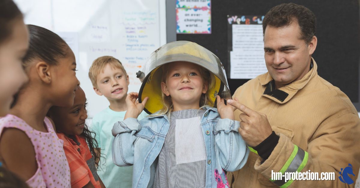 fireman putting a fireman's hat on a kid