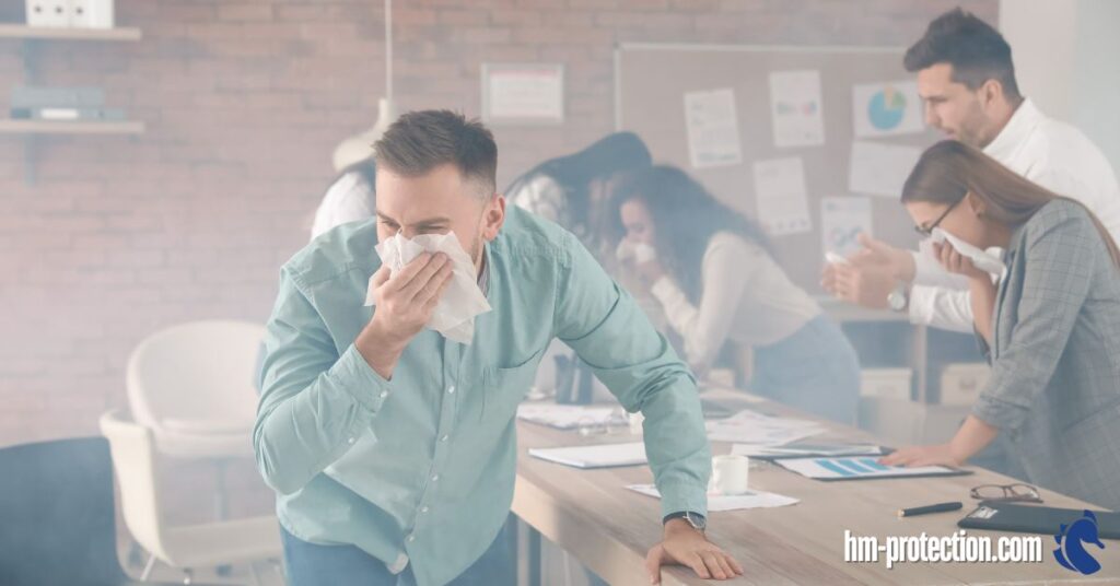 office worker covering nose and escaping from a workplace fire
